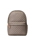 Quilted backpack with a visible brand logo on a light gray background