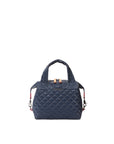 Navy quilted handbag with a visible brand logo on a white background
