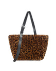 Leopard print handbag with black strap on a white background