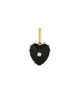 Heart-shaped pendant with black stone and gold accents on a white background