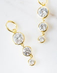 Mini Dropping Circles Huggie Hoop Earrings Cubic Zirconia Earrings Laura Foote Designs