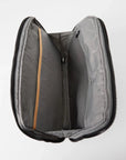 Aerial view of interior of MZ Wallace Metro Organizer Black Cosmetic with one open interior pocket and one zipper mesh pocket.