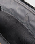 Interior of MZ Wallace Metro Organizer Black Cosmetic mesh zipper pocket with white background.