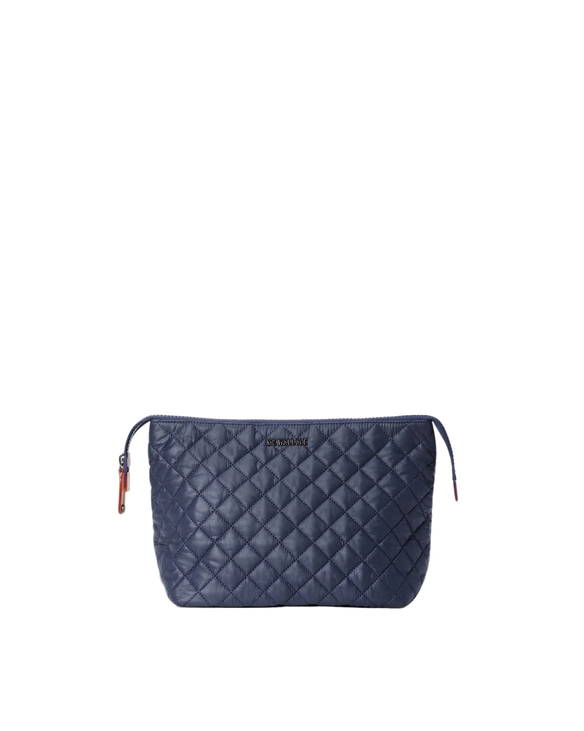Quilted navy blue pouch on a white background