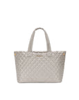 Quilted tote bag with a brand logo on a white background