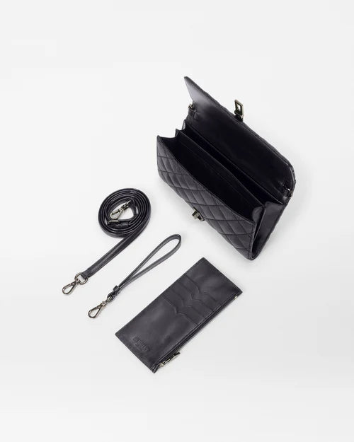 top view of the mz wallace Astor Convertible Crossbody Black on a grey background  with the straps and interior wallet laid out