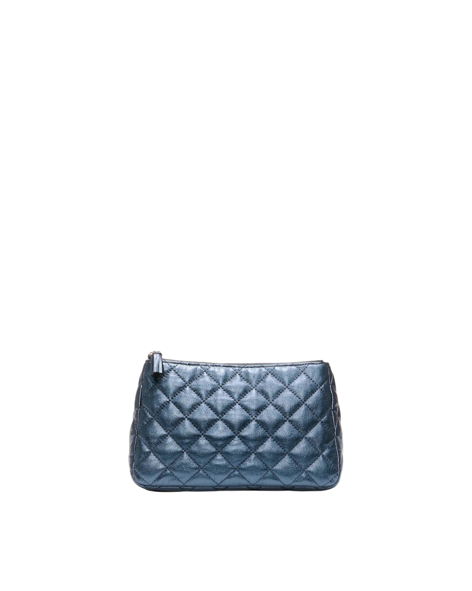 Blue quilted clutch bag on a white background