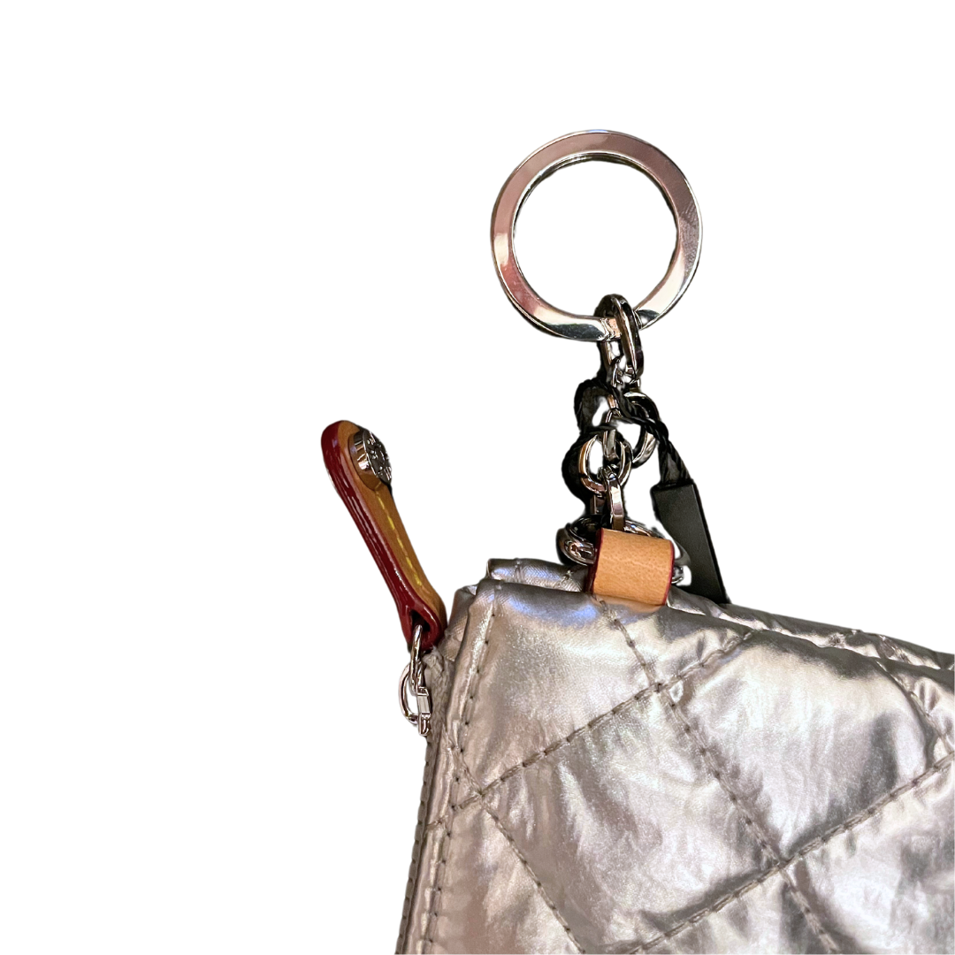 close up of key hook on mz Wallace Flat Metro Key Pouch Silver Metallic on a white background