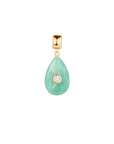 Teardrop-shaped pendant with gold frame and clear gemstone on a white background