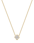 Gold necklace with a clover-shaped pendant on a white background