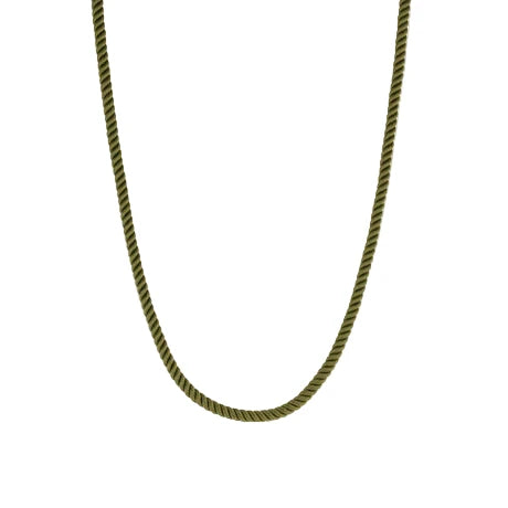 Green braided necklace on a white background