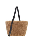 Brown fluffy bag with a black strap on a white background