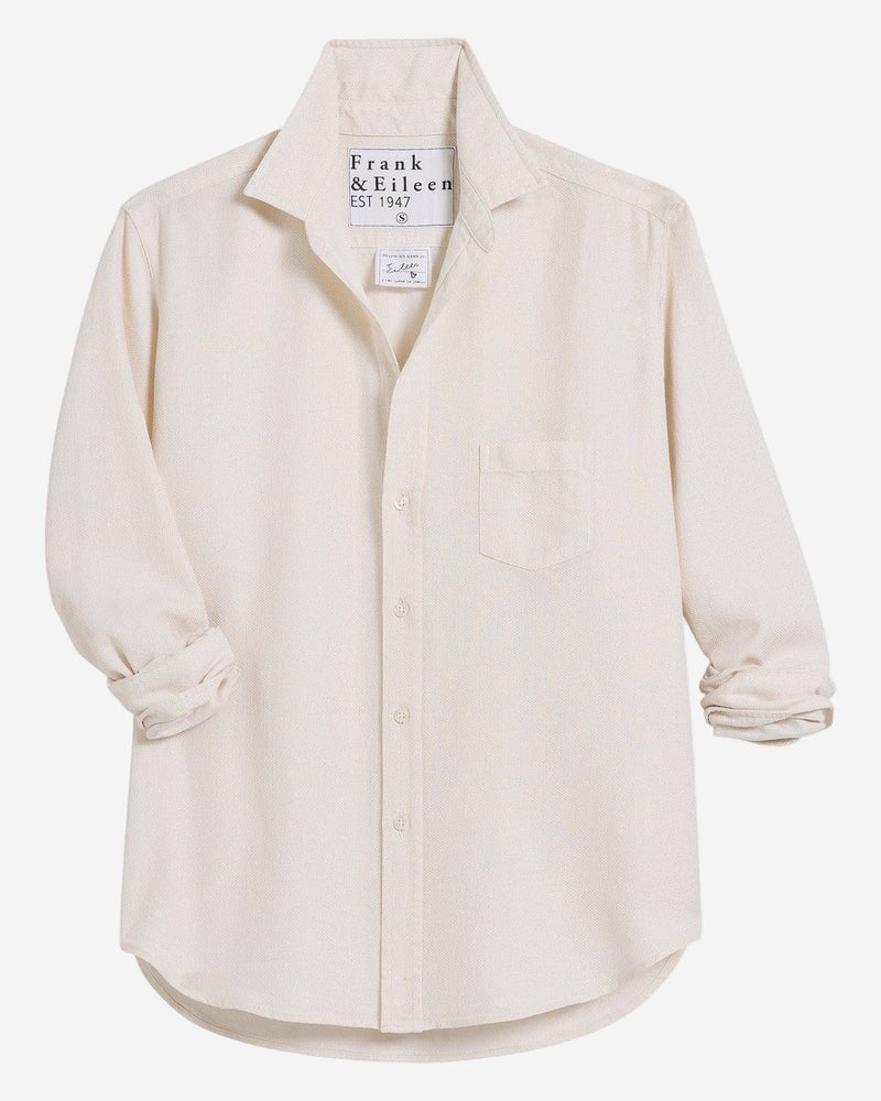 Beige shirt with brand label on a white background
