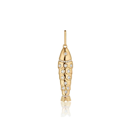 Gold fish-shaped pendant with embedded stones on a white background