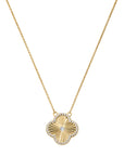 Gold necklace with a sunburst pendant on a white background