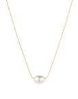 Pearl necklace on a gold chain against a white background