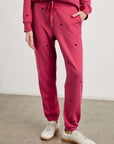 Lower half of rails kingston pink midnight hearts sweatpants on model