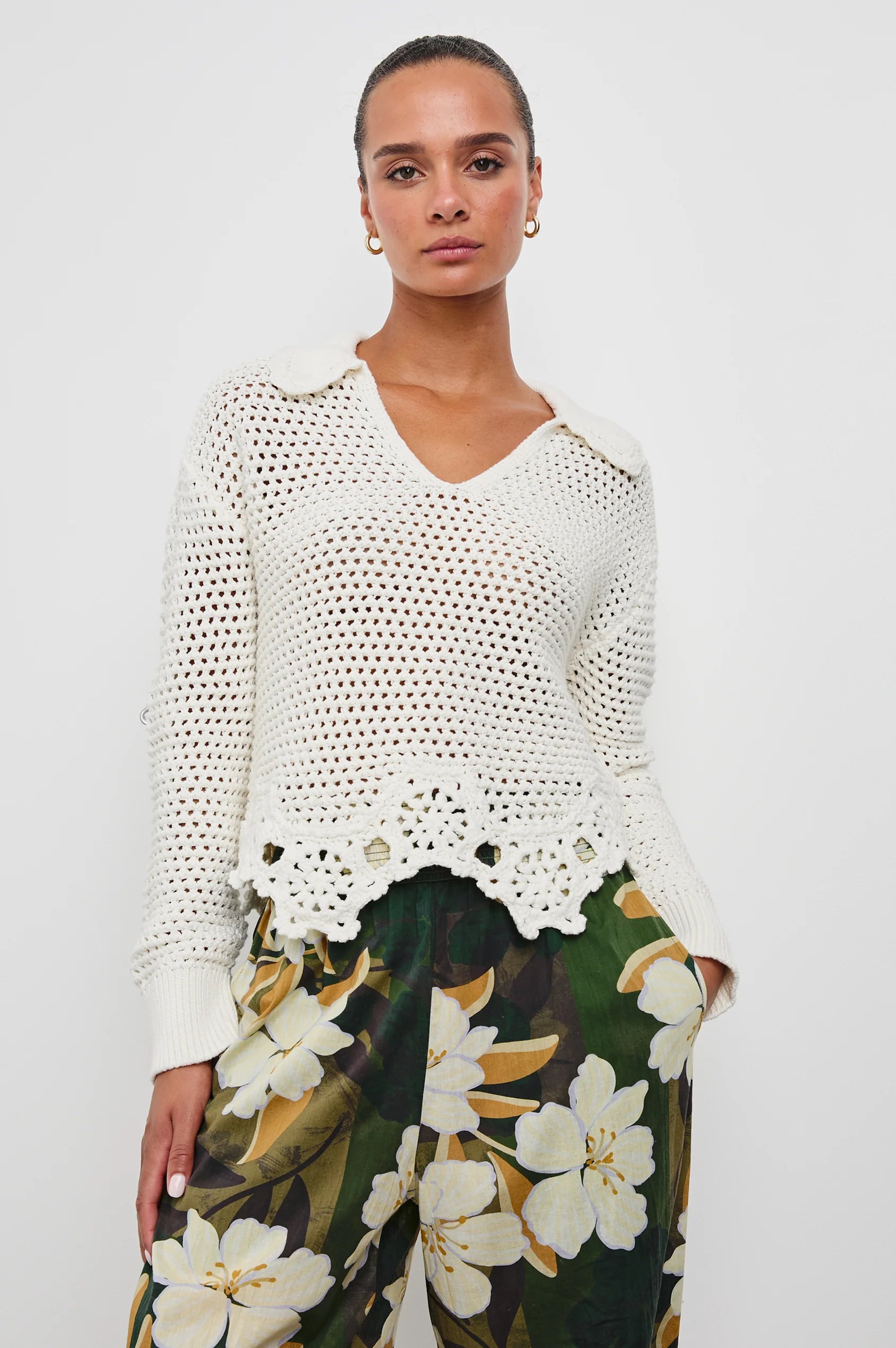 front view of the upper half of a brunette model wearing the rails louise sweater in ivory