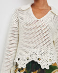 front view of the torso of brunette model wearing the rails louise sweater in ivory