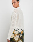 back view of the upper half brunette model wearing the rails louise sweater in ivory