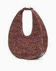 side view of Staud Large Raffia Moon Tote Bag in Mahogany with white background