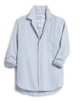 cutout front view of  frank & eileen Eileen Relaxed Button Up Gray Blue with jeans in front of a console table and art