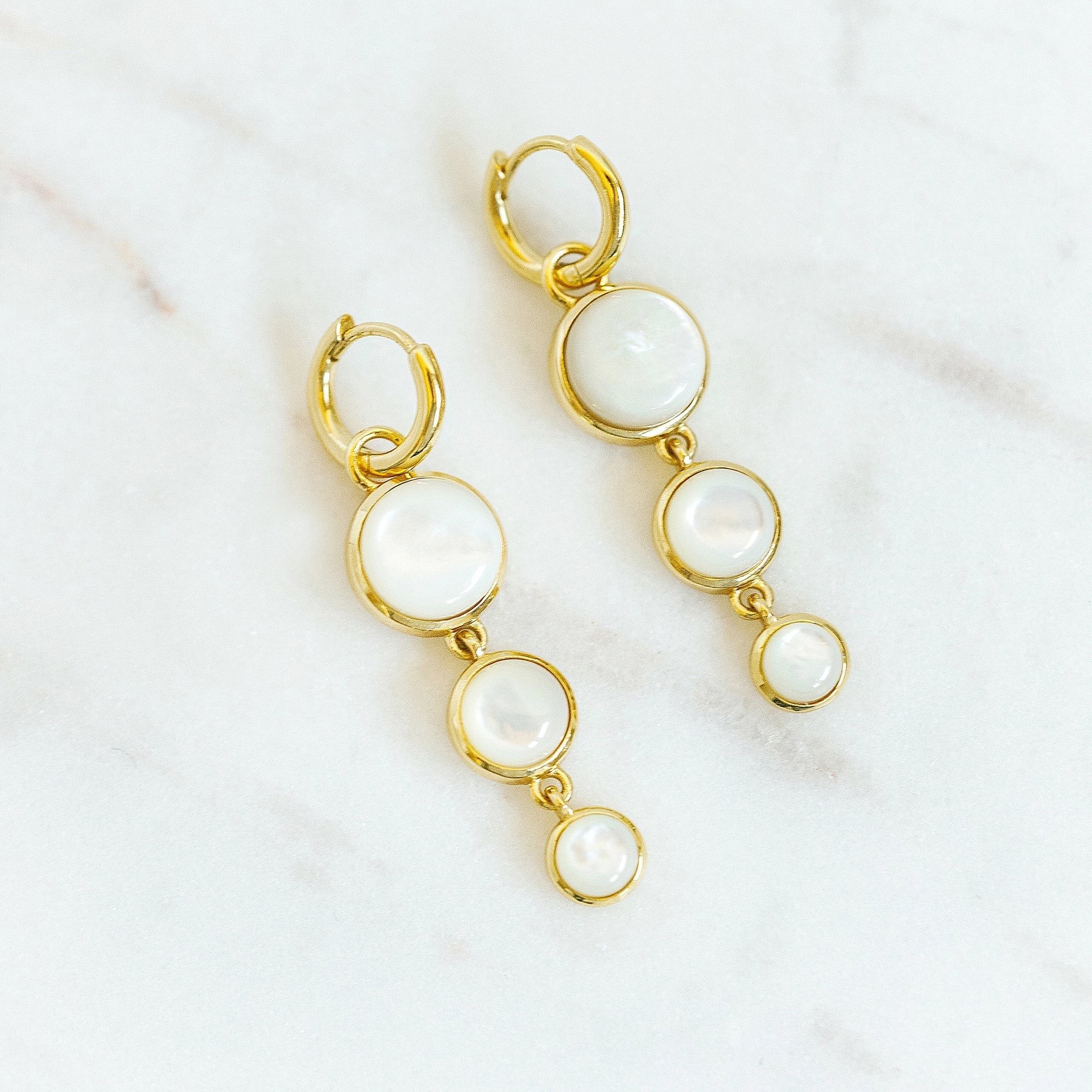 Mini Dropping Circles Huggie Hoop Earrings Mother of Pearl Earrings Laura Foote Designs 