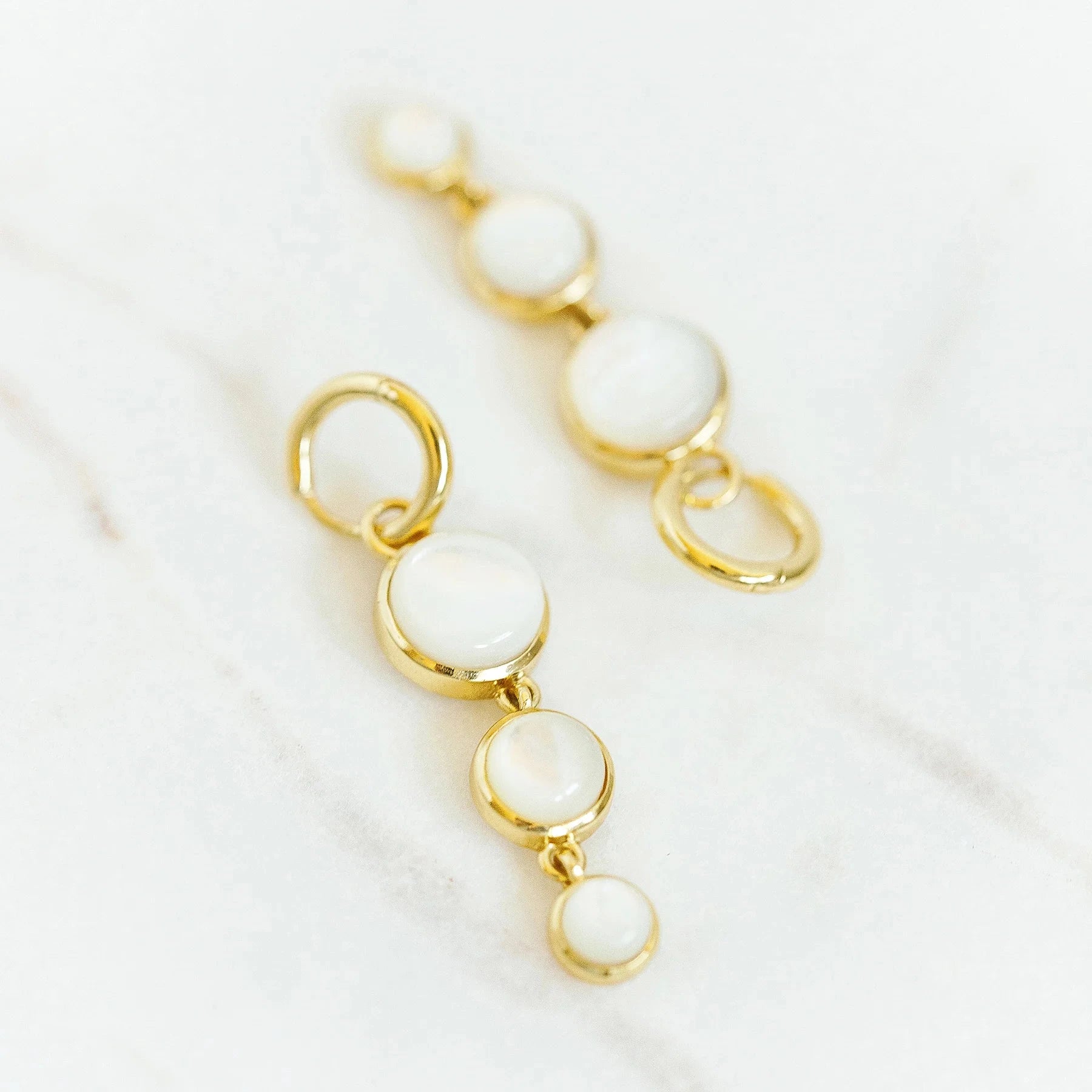 Mini Dropping Circles Huggie Hoop Earrings Mother of Pearl Earrings Laura Foote Designs 