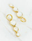 Mini Dropping Circles Huggie Hoop Earrings Mother of Pearl Earrings Laura Foote Designs 