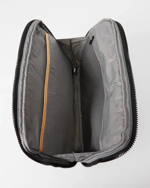 Aerial view of interior of MZ Wallace Metro Organizer Black Cosmetic with one open interior pocket and one zipper mesh pocket.