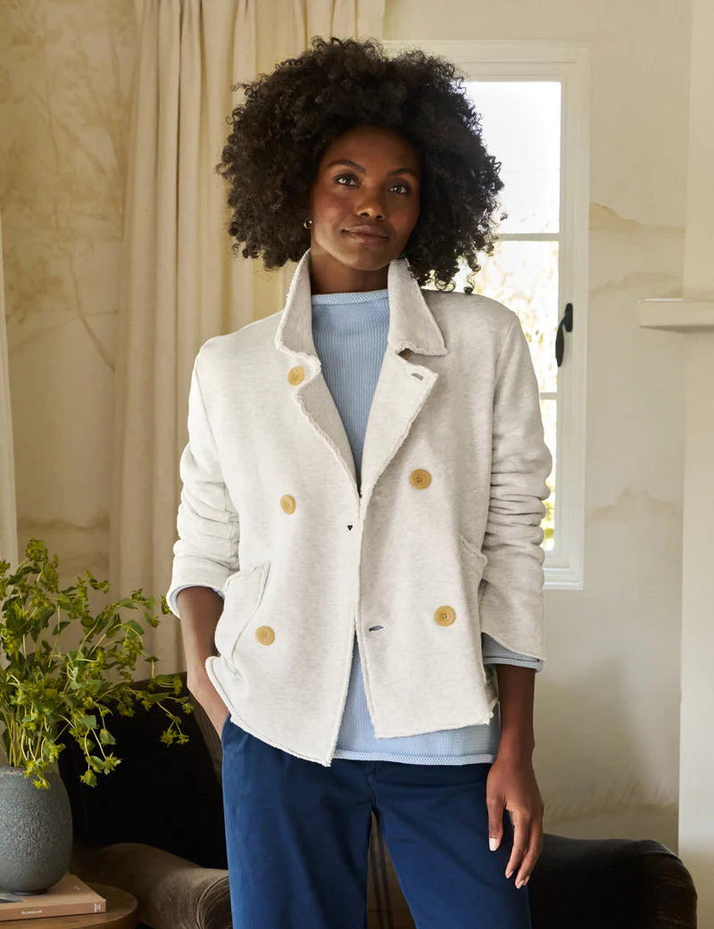 front top half view of the frank & eileen Mini Belfast Crop Fleece Peacoat Heather White Melange on a black model wearing a blue sweater and navy trousers in front of a chair and window