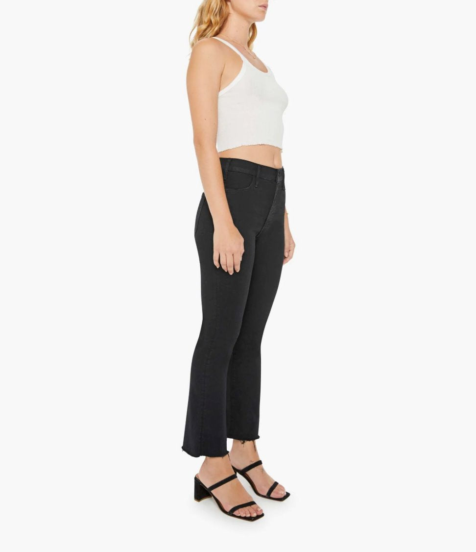 full 3/4 view of model wearing the mother Lil Hustler Ankle Fray Not Guilty, a white tank, and black sandals on a white background 