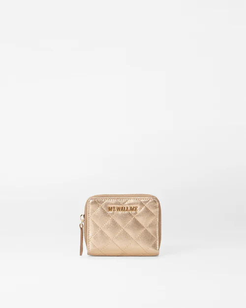 front view of mz Wallace honey metallic leather small zip round wallet on a white background