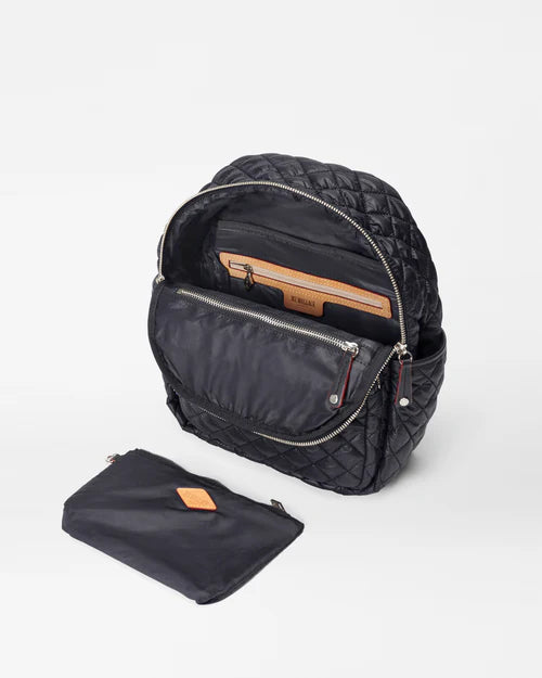 mz Wallace Small Crosby Backpack Black on a white background opened showing interior and pouch