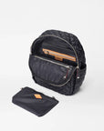 mz Wallace Small Crosby Backpack Black on a white background opened showing interior and pouch