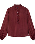 Maroon blouse with long sleeves on a white background
